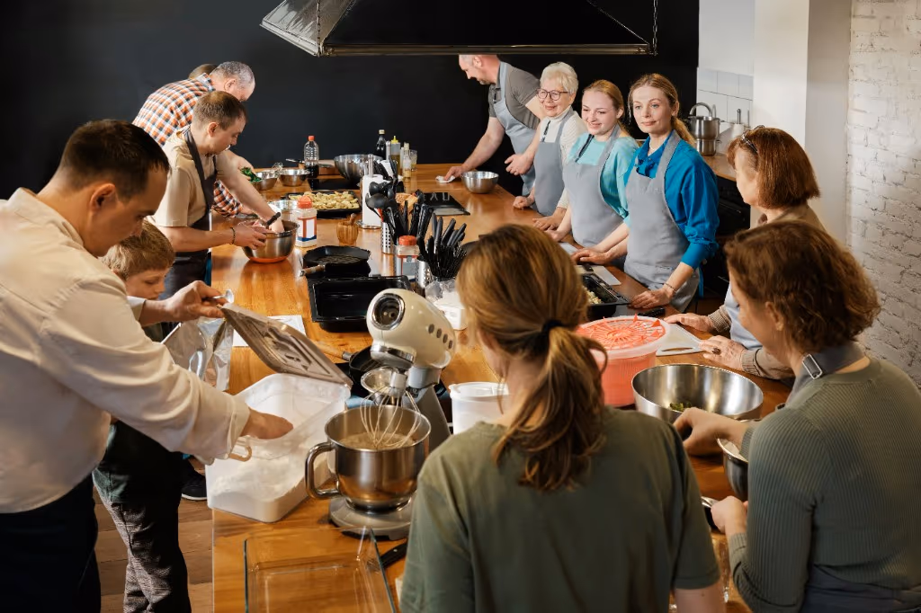 Colleagues cooking in a brigade during a corporate culinary activity