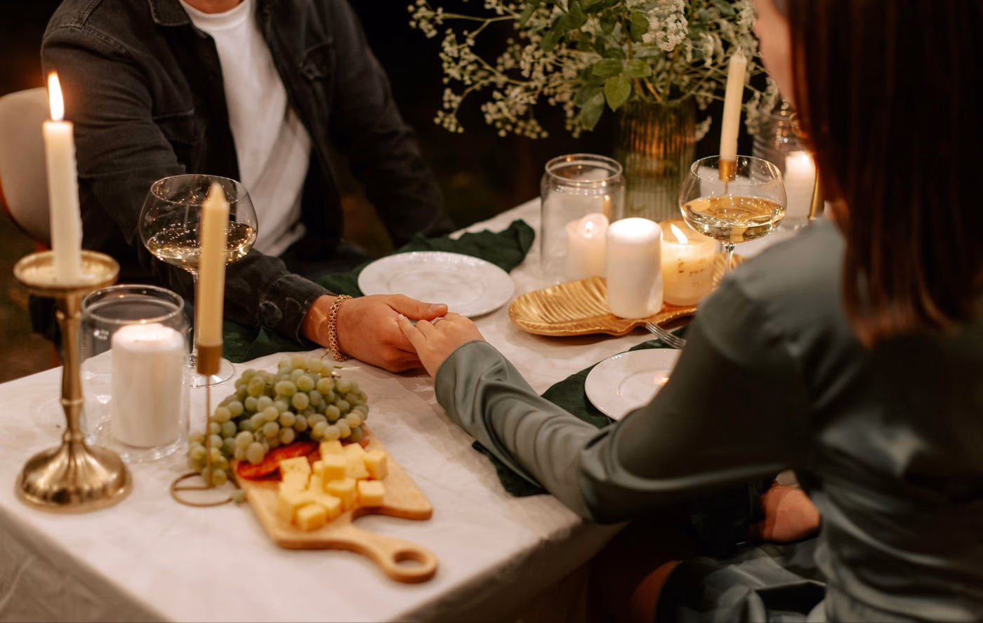 Private chef serving a gastronomic dish during a romantic dinner at home in Montreal