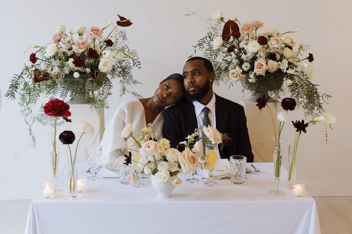 Newlyweds sharing a gastronomic meal served at home during an intimate reception