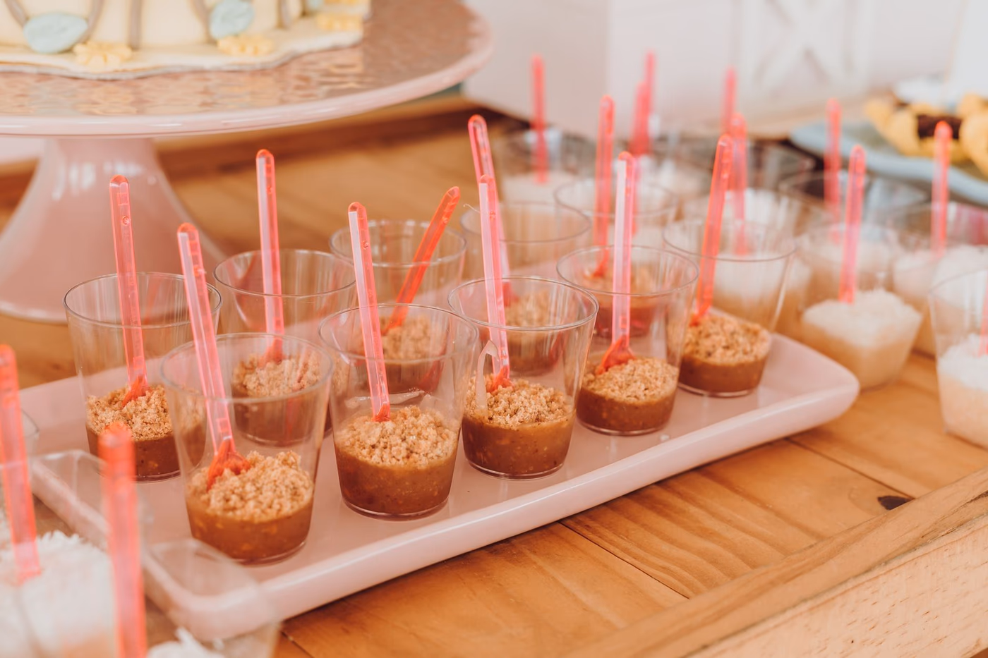 Elegant dessert table for a baby shower at home with homemade canapés and fresh fruit