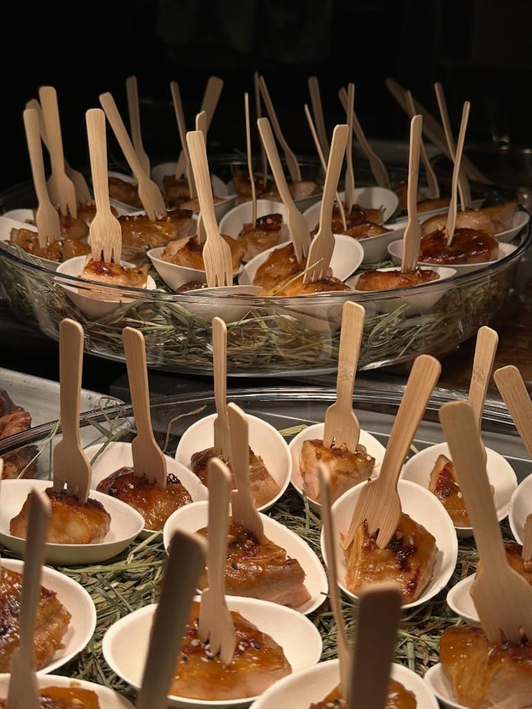 Canapés in cups served with wooden forks