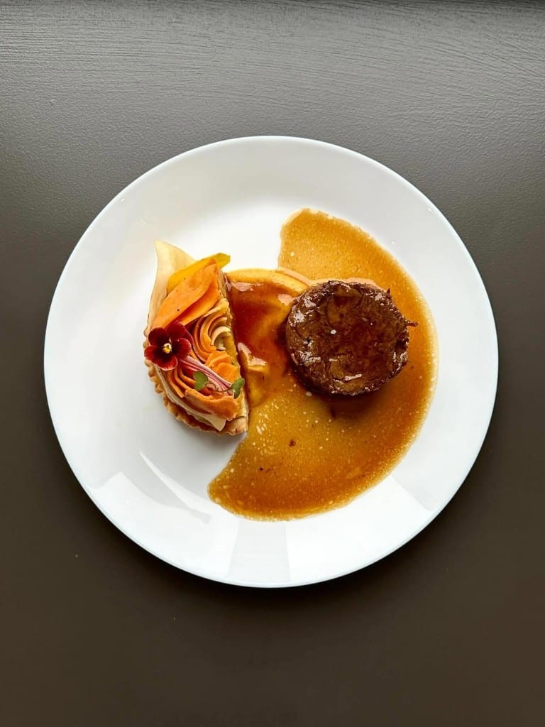 Filet and vegetable tart plated together