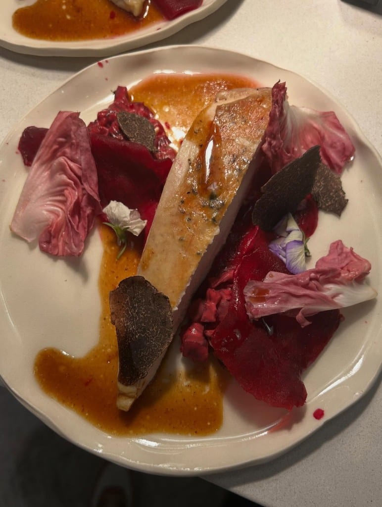 Fish plated with beets and radicchio