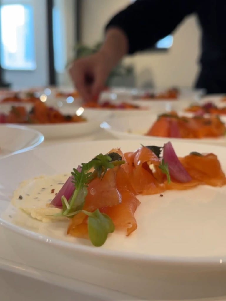 Plates of smoked salmon dressed by Chef Max Delmont
