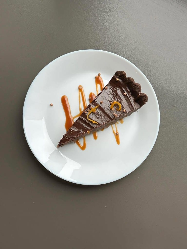 Chocolate tart finished with a caramel drizzle